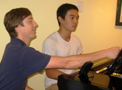 Craig with a piano student